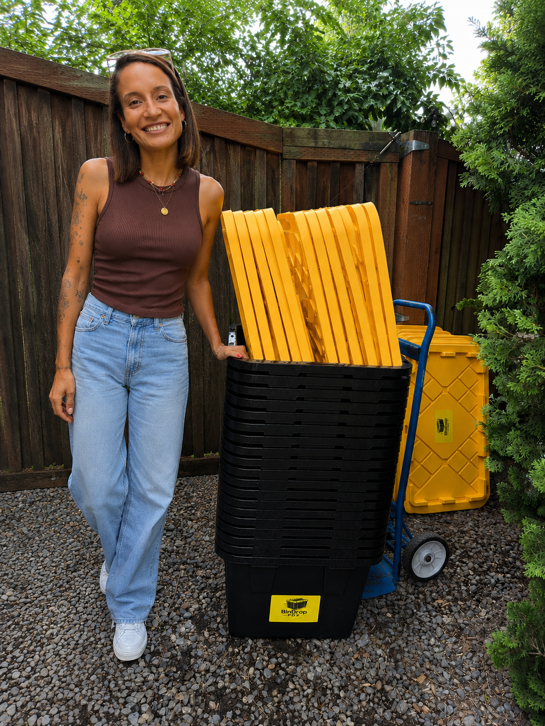 BinDrop PDX owner holding a branded moving bin